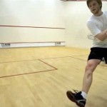 squash rules player hitting a backhand